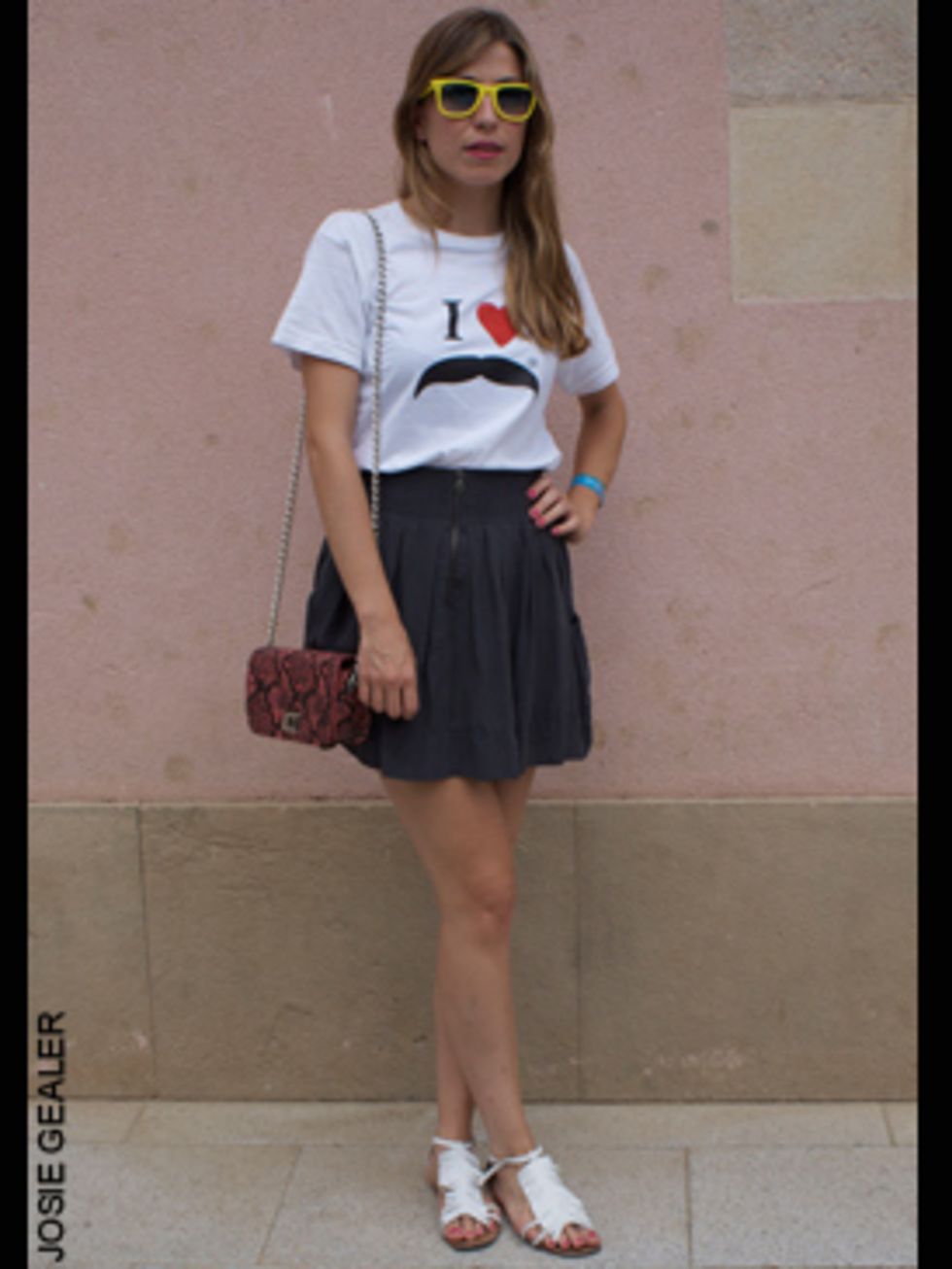 <p>Paula Menenoez, journalist, wearing a tshirt made by a friend, skirt from Topshop and a Zara bag</p>