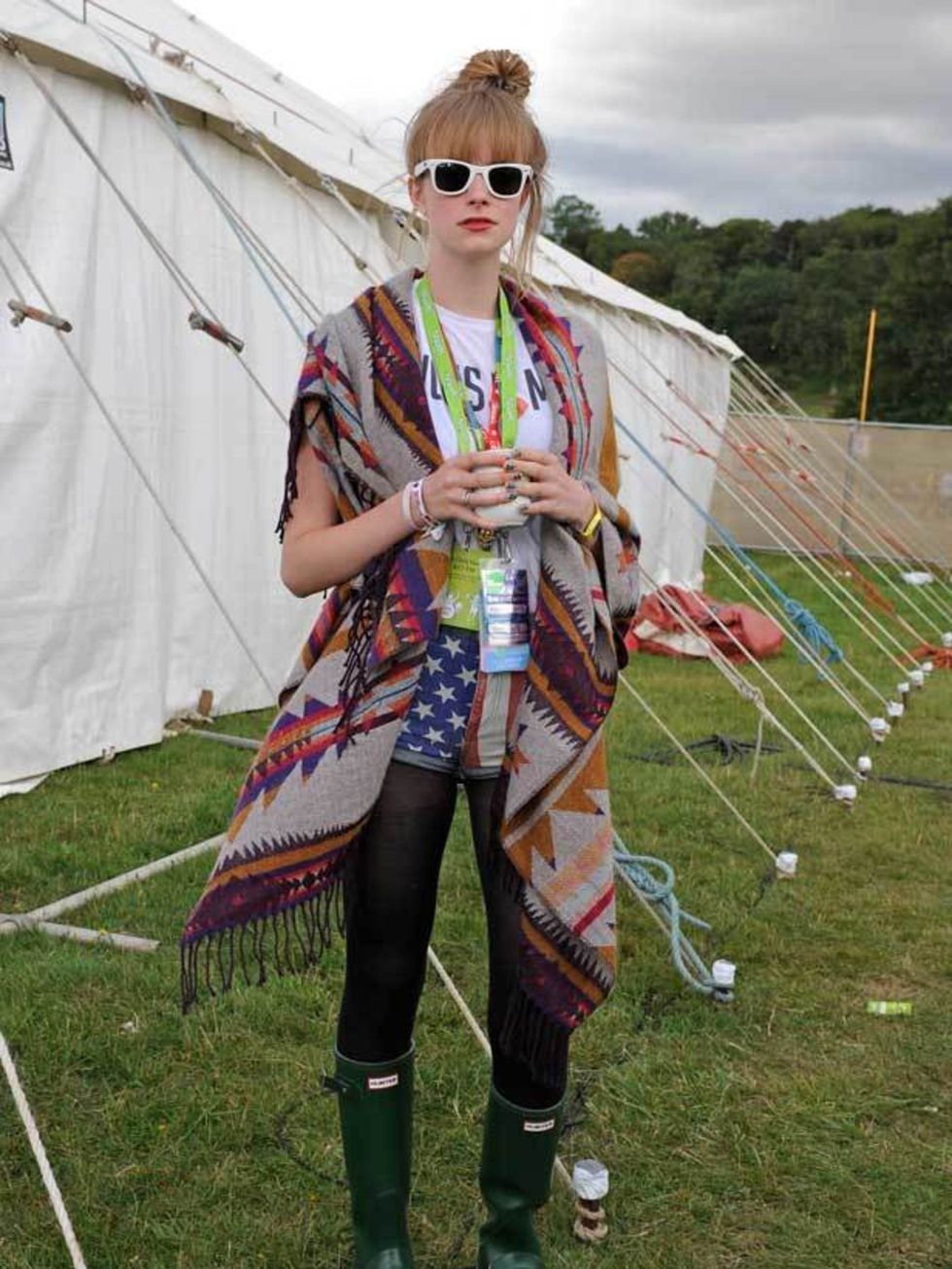 <p>Photo by Alistair Guy.Sophie, 18, Student. H&amp;M poncho, Topshop t-shirt and shorts, Vivienne Westwood jewellery, Hunter wellies.</p>