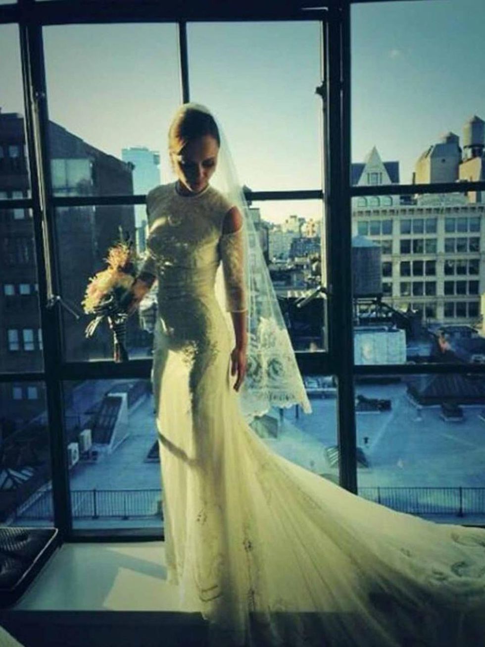 <p><a href="http://www.elleuk.com/elle-style-awards/news/christina-ricci-s-good-vintage">Christina Ricci</a> wears a custom-made <a href="http://www.elleuk.com/catwalk/designer-a-z/givenchy/spring-summer-2014">Givenchy</a> dress for her wedding, September