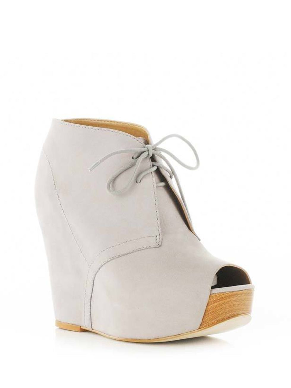 <p><a href="http://www.riverisland.com/Online/women/shoes--boots/heels--wedges/grey-lace-up-wedges--598595">River Island</a> peep-toe wedge boots, £74.99</p>