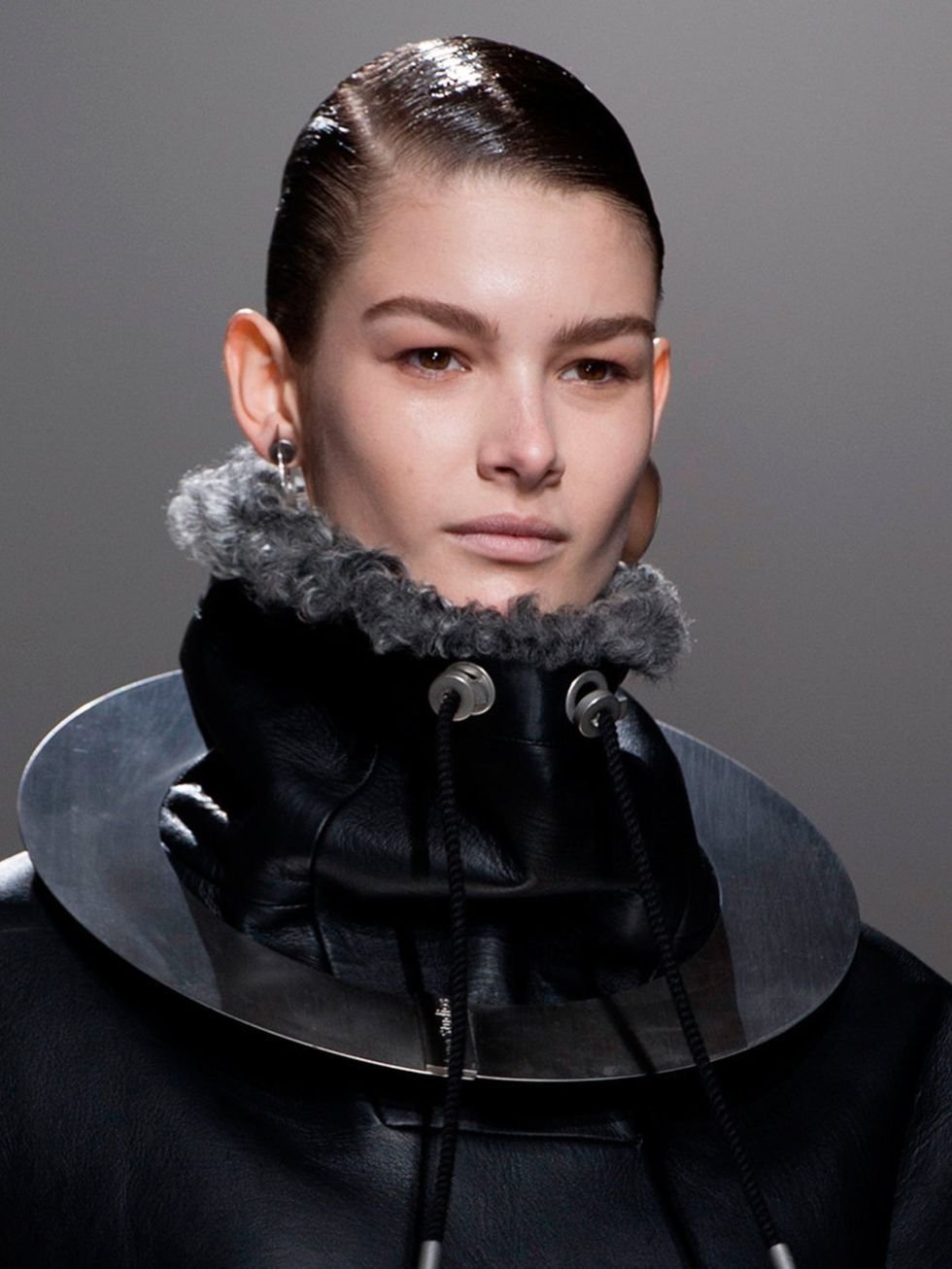 <p>Hair Stylist: Anthony Turner for L'Oreal Professionnel</p><p>Look: HIgh-shine ponytails to offset the earthy textures and knits in the collection.</p><p>Inspiration: Androgyny</p><p>Key Product: L'Oreal Professionnel Tecni.Art Glue</p><p>Tip: Use the g