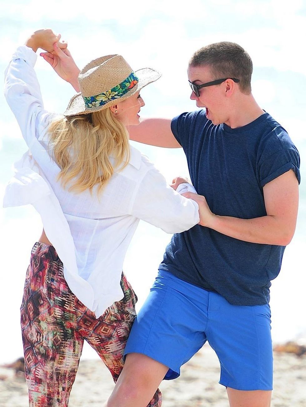 <p>Dancing on a beach, in the sunshine, with a beautiful woman Jealous? Us? </p>