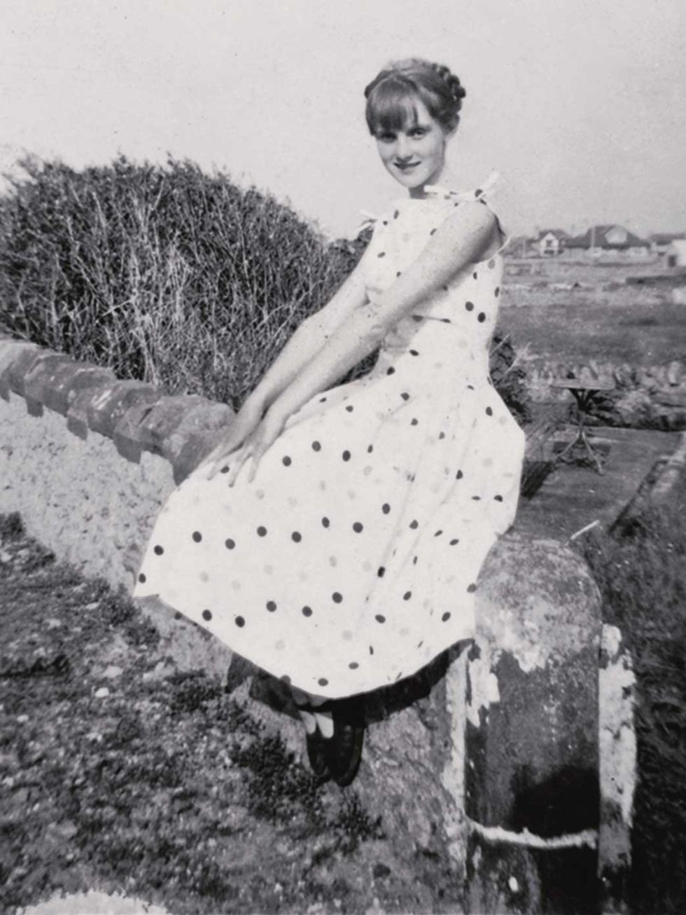 <p>'In a modelling mood at home, wearing an A-line dress, Tre-Arddur Bay, 1954'</p>