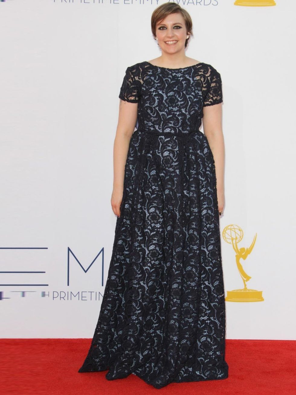 &lt;p&gt;Lena Dunham wears a black lace &lt;a href=&quot;http://www.elleuk.com/catwalk/designer-a-z/prada/spring-summer-2013&quot;&gt;Prada&lt;/a&gt; dress to the 2012 Emmy Awards in LA.&lt;/p&gt;