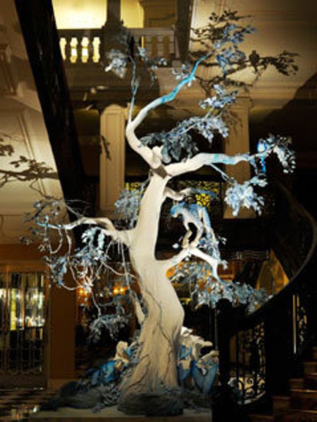 <p>Naturally the ever-creative designer decided to ditch the traditional fir and opted instead for a tropical tree adorned with snow leopards, dragon flies and parrots. It puts our tinsel and fairy lights efforts to shame. </p><p>The incredible tree was u