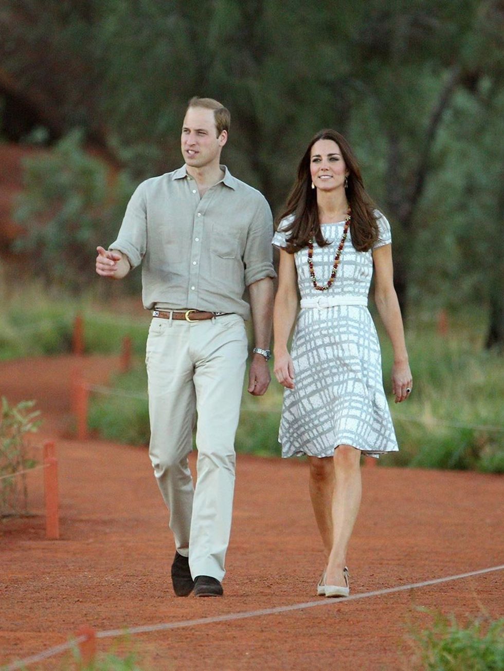<p>Kate - in a favourite, worn-before £35 Hobbs dress - walks down Kuniya Walk at the base of Uluru in Ayers Rock, Australia, with <a href="http://www.elleuk.com/star-style/celebrity-style-files/prince-william-elle-man-of-the-week">Prince William</a>.</p>