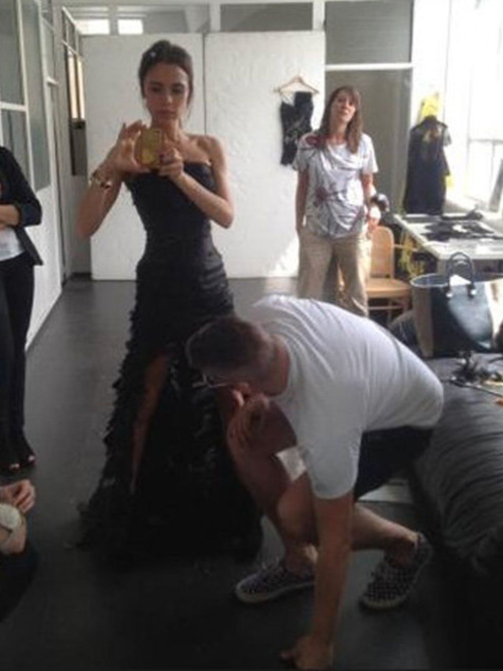 <p>Victoria Beckham in a pre-Closing Ceremony fitting with designer Giles Deacon</p>
