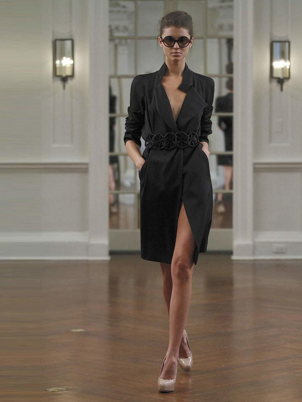 <p><a href="http://www.elleuk.com/catwalk/designer-a-z/victoria-beckham/autumn-winter-2010/collection">AW10</a></p><p>This is the ultimate LBD, a mixture of a trench coat and a shirt dress which makes it extremely feminine and incredibly sexy in the most 