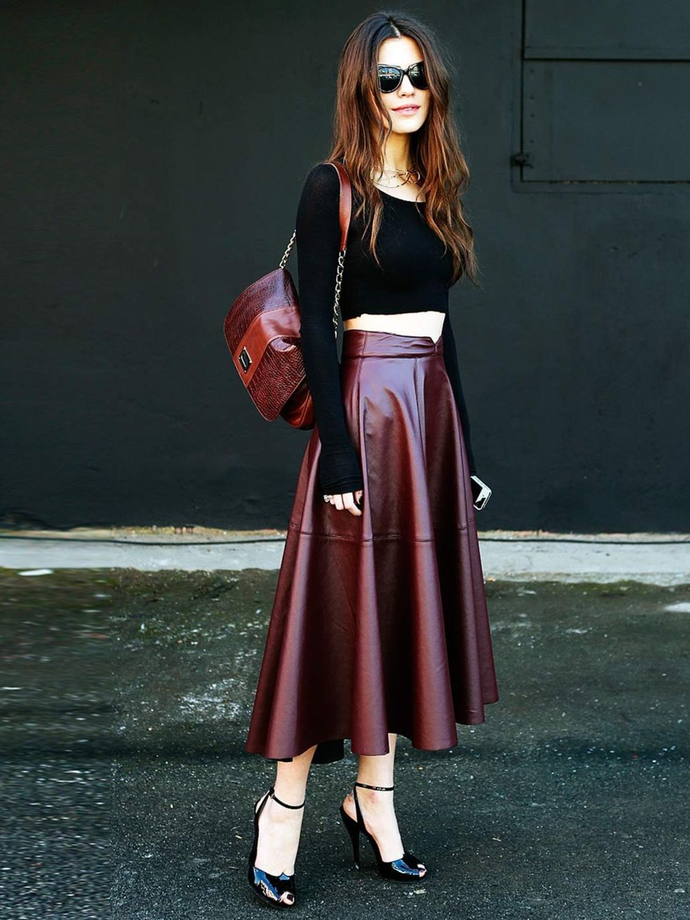 <p>A bare midriff looks ladylike when worn with a leather midi skirt and heels, Turkey.</p>