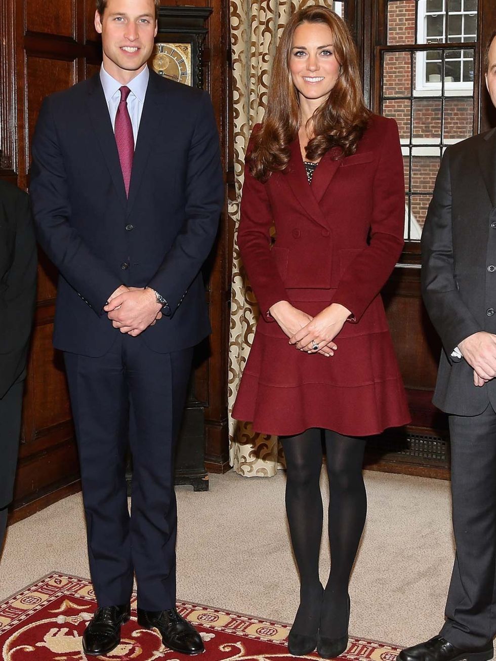 <p>Kate Middleton wears a red Paule Ka skirt suit, with LK Bennett pumps.</p>