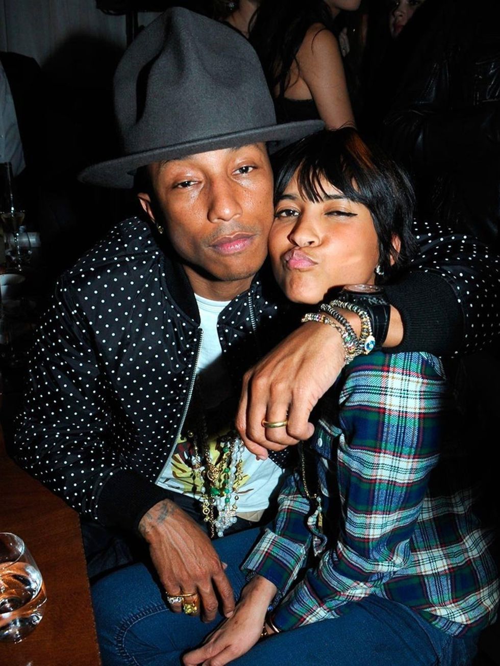 <p><a href="http://www.elleuk.com/elle-style-awards/red-carpet/elle-style-awards-2014-the-winners">Pharrell Williams</a> and Helen Lasichanh at the BRITs 2014 Universal after-party at the Soho House pop up.</p>
