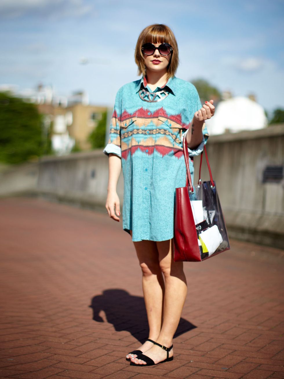 <p>Hannah Hope wears a vintage shirt and bag from Africa, H&amp;M shoes, Topshop necklace</p>