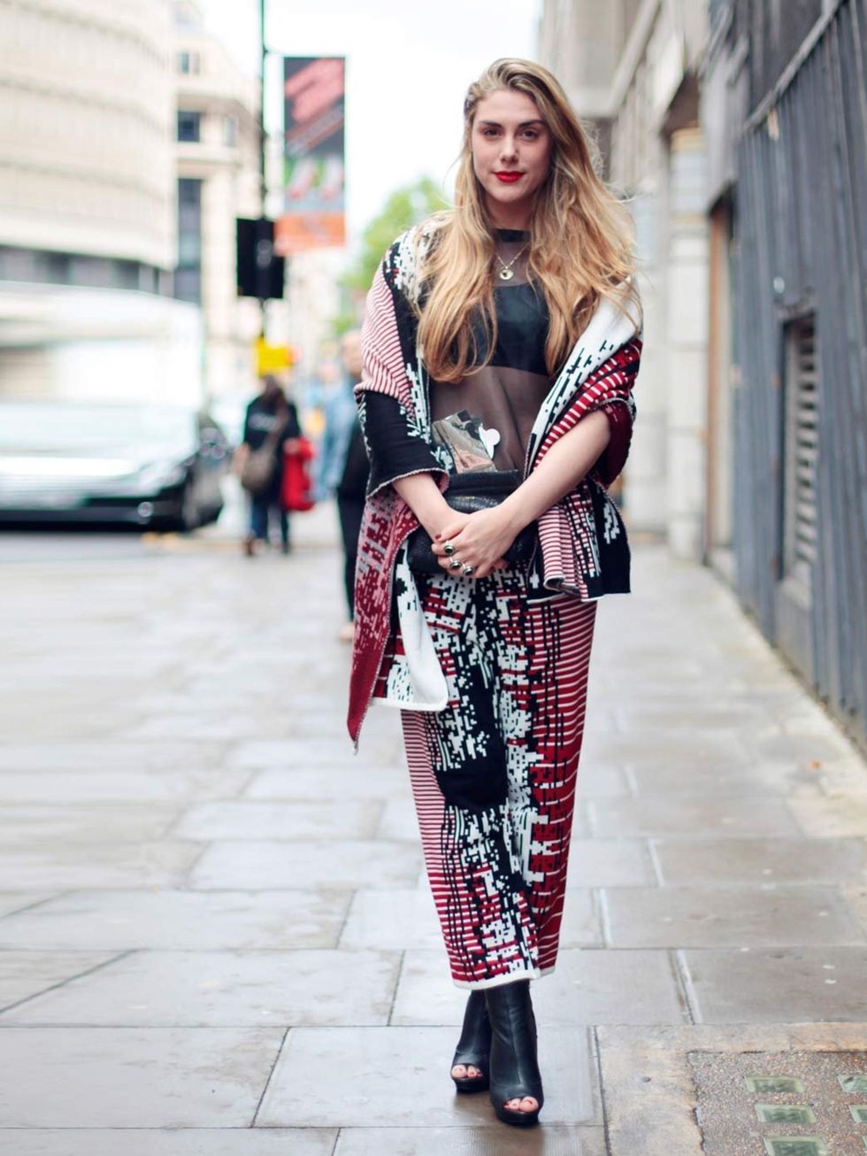 <p>DAY ONE: Elena Saurel wears a HAD shawl and trousers, Acne clutch and Topshop shoes.</p>