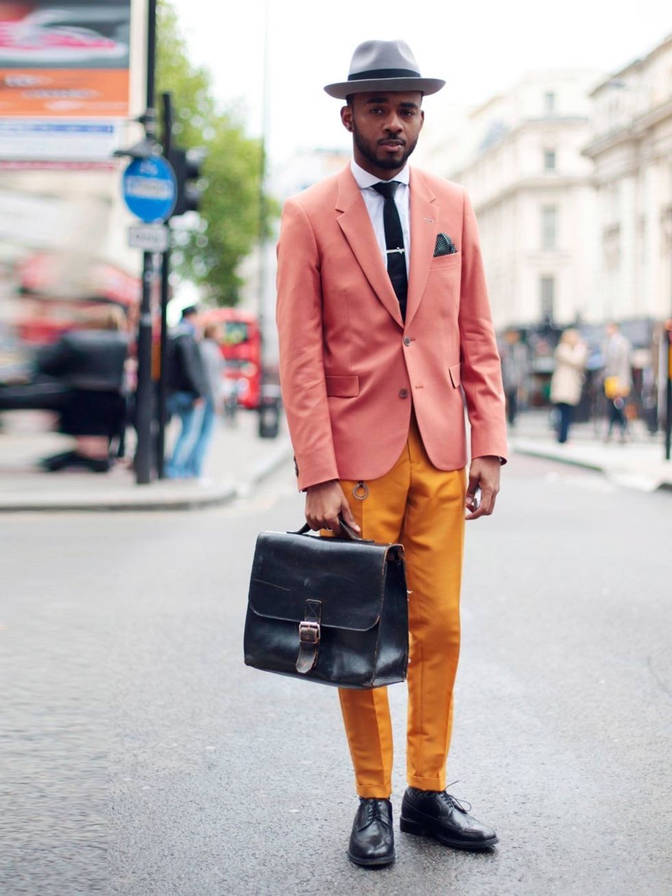 <p>Martell Campbell wears a Paul Smith suit styled with a vintage bag, Oliver Sweeney shoes and Lock &amp; Co hat.</p>