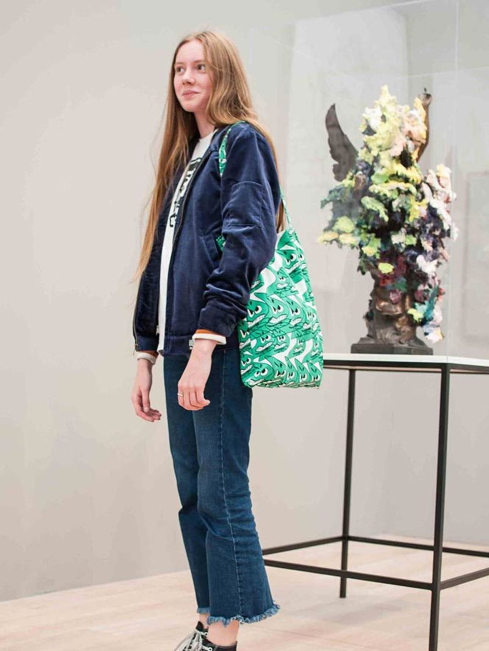 Isobel wears a Supreme jacket, Converse shoes, Zara jeans and Bernard Wilhem bag