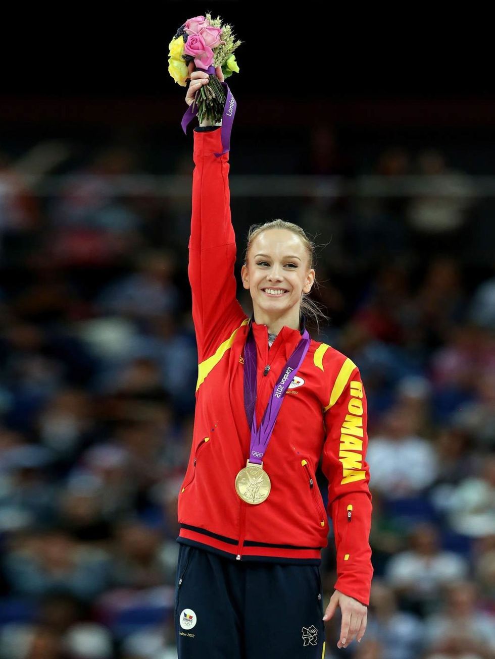 <p>Sandra Raluca Izbasa celebrates her gold medal following the Artistic Gymnastics Women's Vault final at the London Olympics, August 2012.</p>