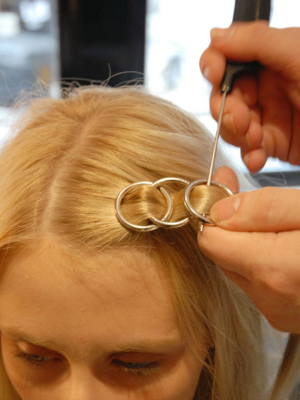 &lt;p&gt;&lt;strong&gt;Step ten:&lt;/strong&gt; Place your third hoop over the second and weave the hair through (see picture).&lt;/p&gt;