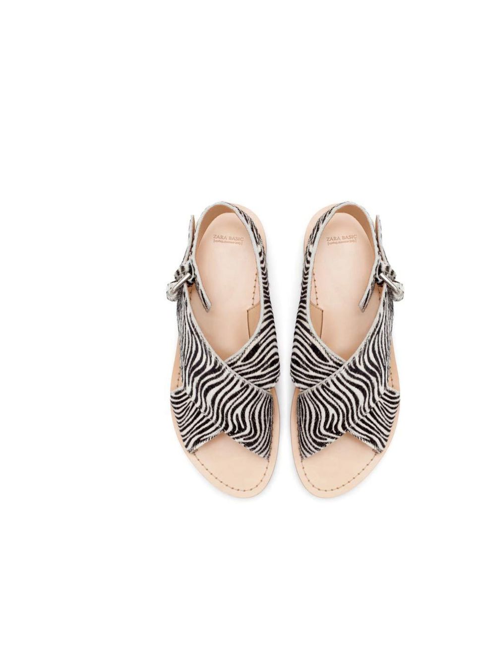 <p>These zebra-stripe sandals will add a little punch to any outfit; Acting Picture Editor Rossana Shokrian will be pairing hers with jeans or lightweight cotton trousers.</p><p><a href="http://www.zara.com/uk/en/woman/shoes/zebra-pattern-crossover-sandal
