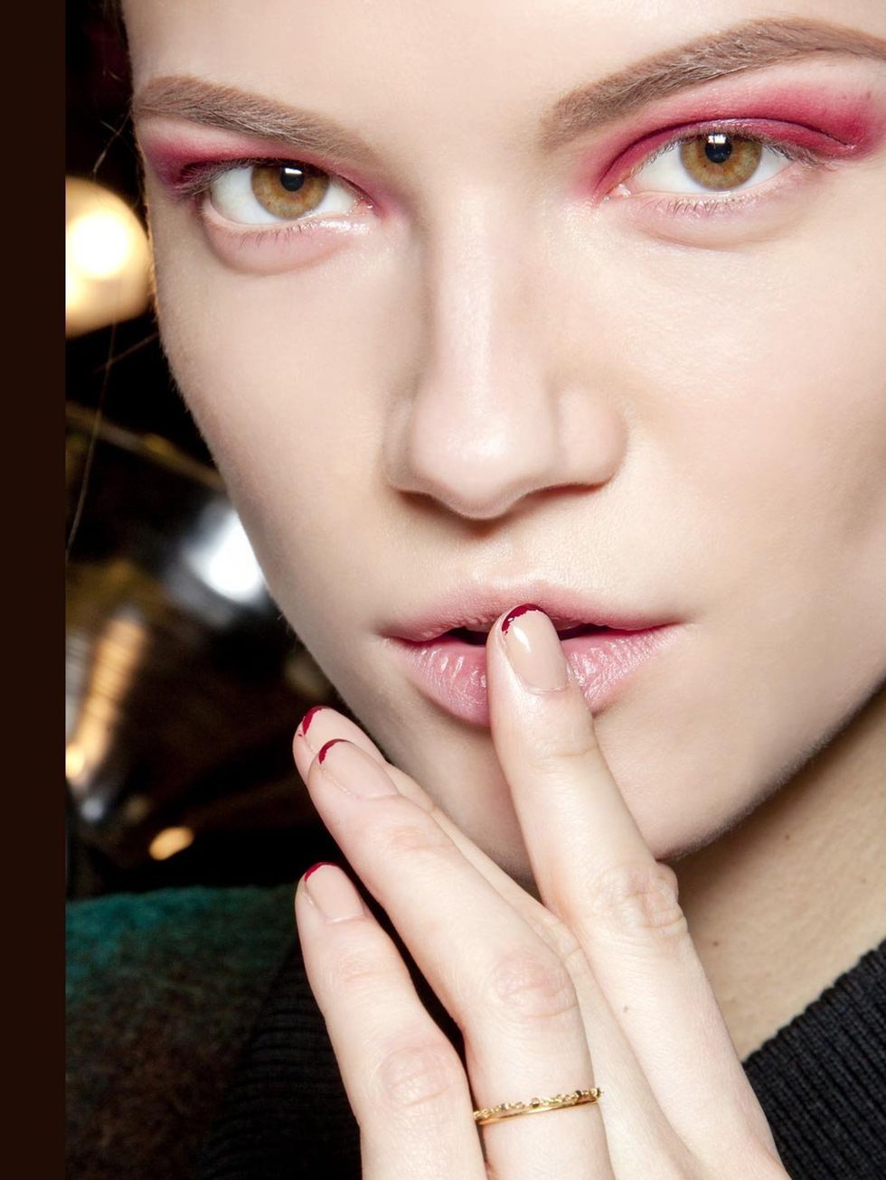 <p>A fresh take on the traditional French manicure say red tips at <a href="http://www.elleuk.com/catwalk/designer-a-z/donna-karan/autumn-winter-2012">Donna Karan</a> mirrored by a smoky red eye look which looked surprisingly wearable.</p>