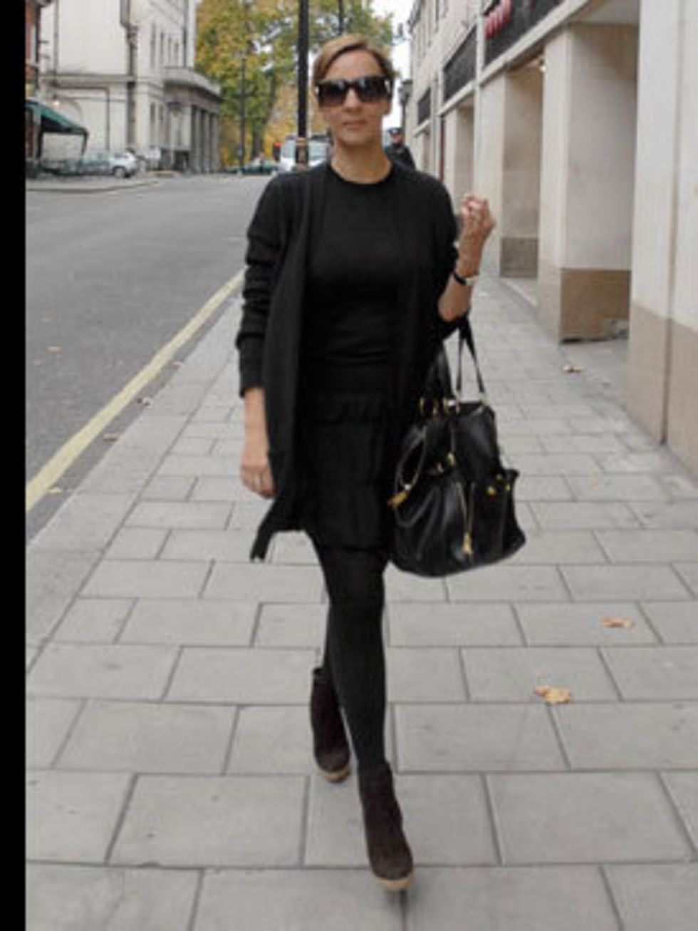 <p>Fashion Director Anne-Marie Curtis describes her look as Audrey Hepburn with a rock and roll edge. Mornings are hectic in her house so she plans her outfit the night before. She teams Gap cashmere with a Miu Miu tiered skirt and Christian Louboutin ank