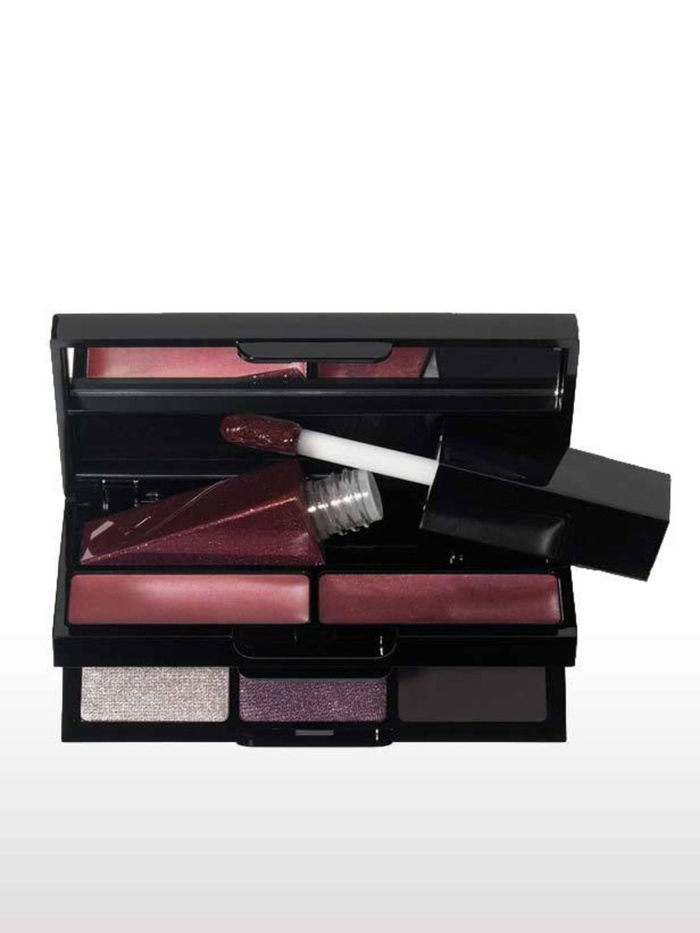 <p>Evening functions are a pre-requisite of fashion week so thank god for this mini kit that includes three eyeshadows for a no-brainer smoky look, as well as plum-toned glosses for instant glamour. Its dinky size means it comes everywhere with me while t