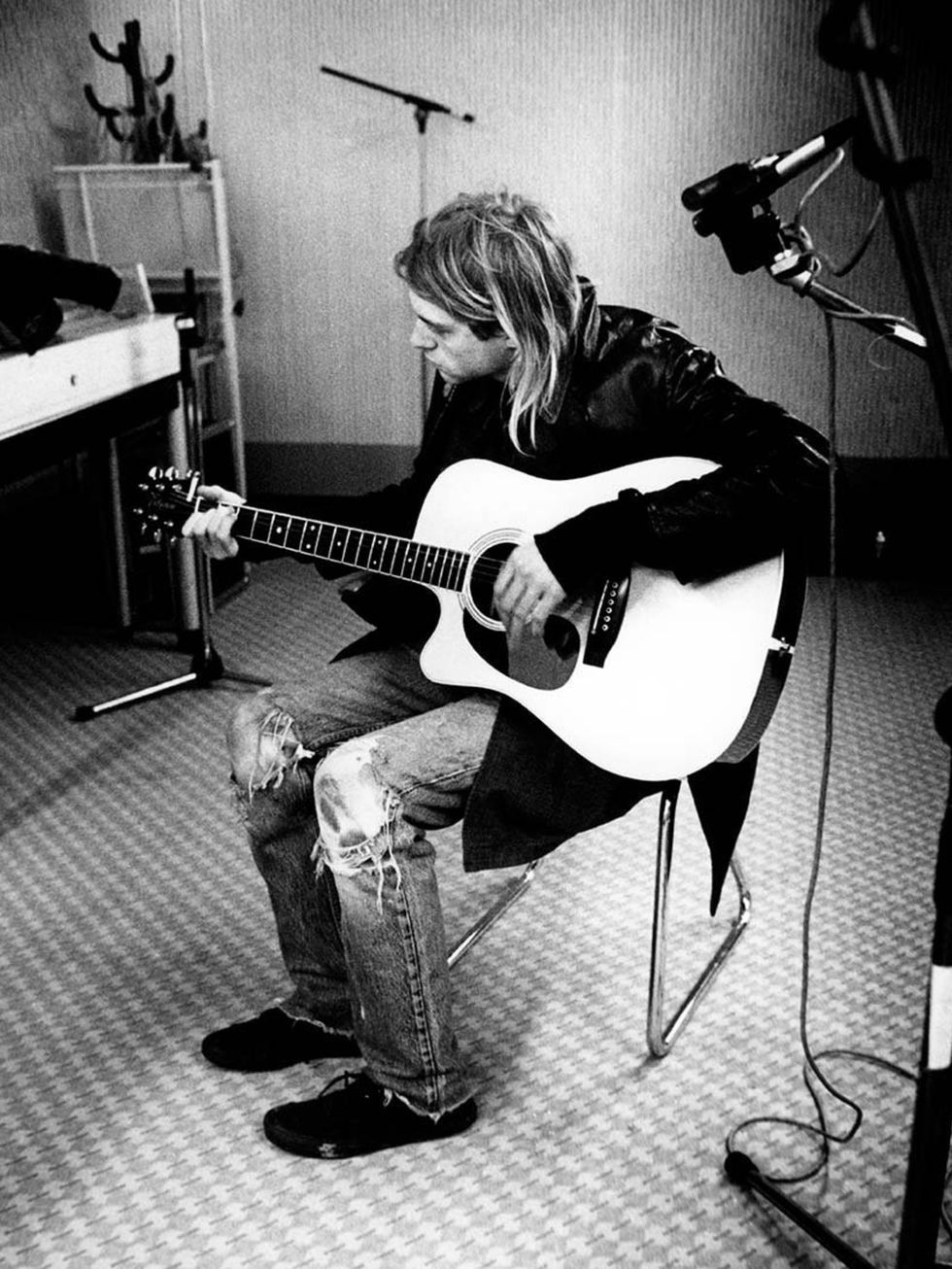 <p><strong>Kurt Cobain, 1991</strong></p><p>Ripped denim accessorised with a guitar. Be still our beating hearts.</p>