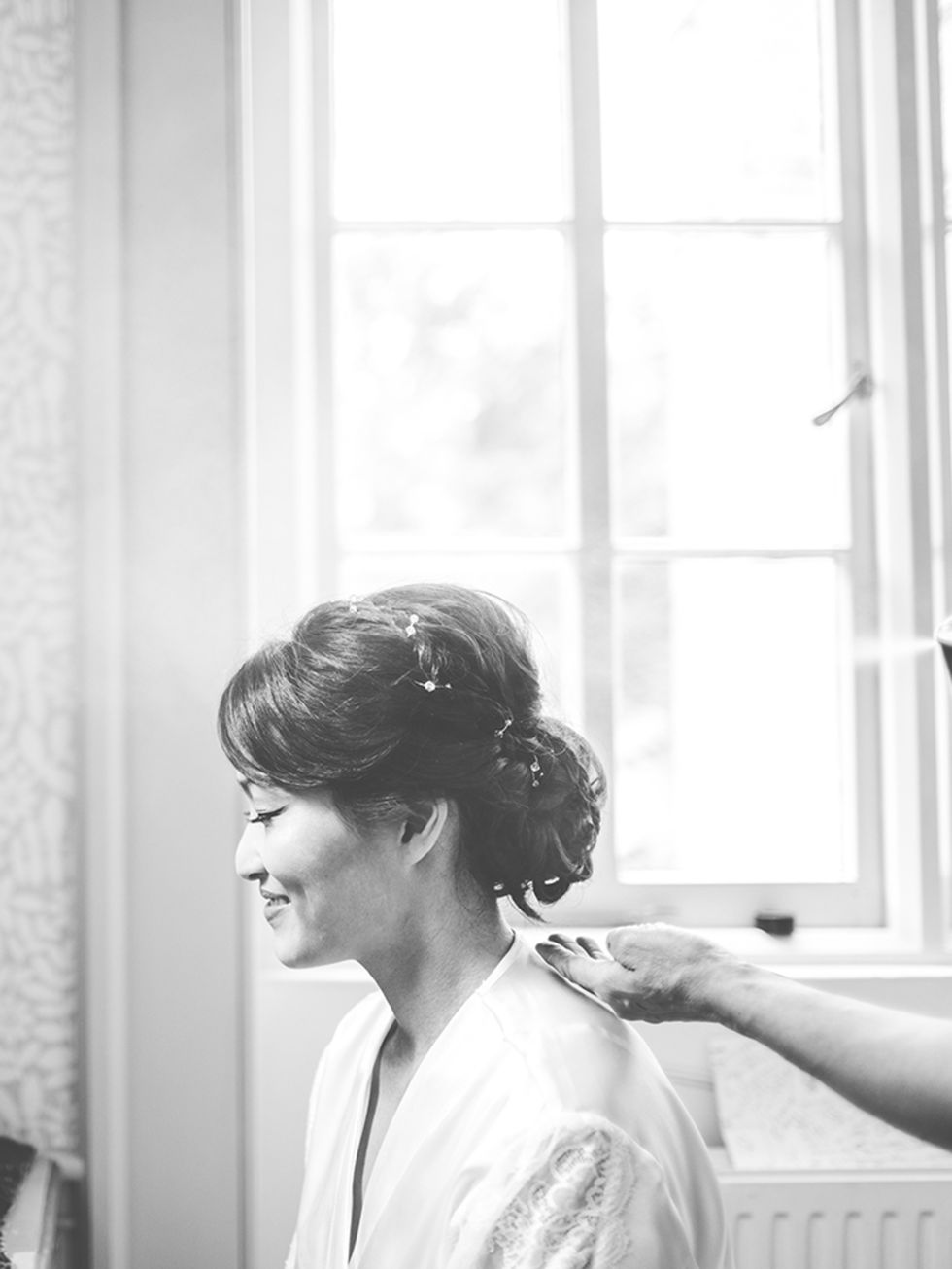 <p><a href="http://www.weddingmakeupandhair.com/" target="_blank">Pam Wrigley</a>, the winner of the 2013 National Wedding Industry Award, did my hair and makeup. She created a curled, chignon-style, incorporating braids and a subtle hair-vine.</p>

<p>Sh