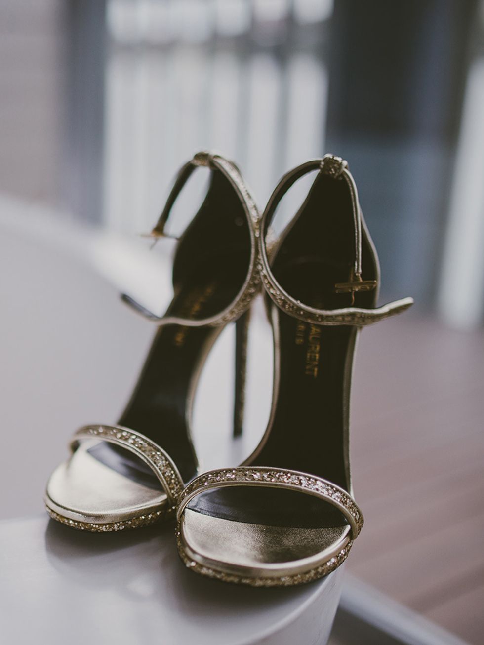 <p>My wedding shoes were Saint Laurent: new-season ankle-strap 'Classic Janes' in gold glitter fabric. </p>
