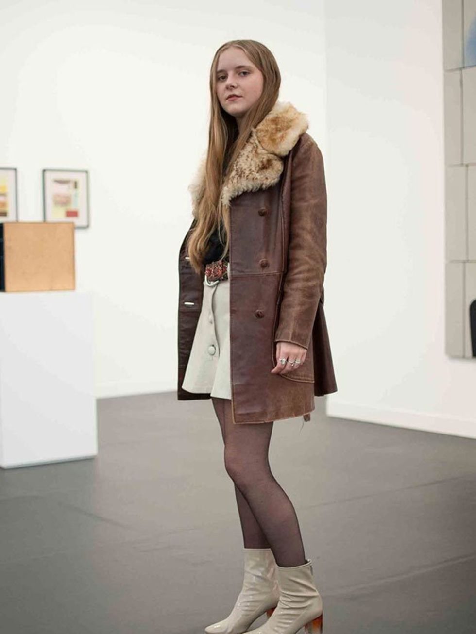 Rafi wears a vintage coat and skirt, Bella Freud jumper, Zara boots and Topshop belt