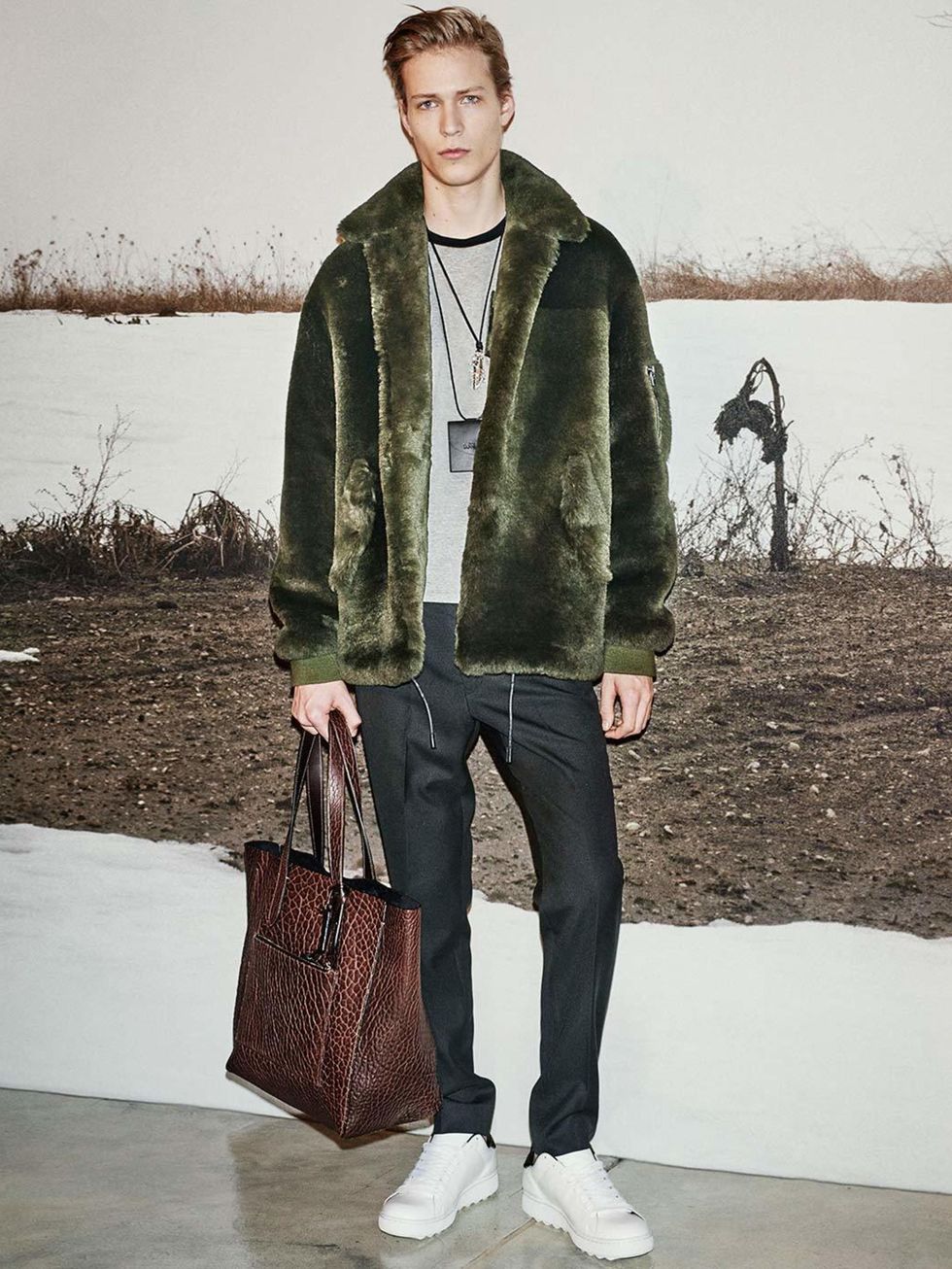 Stuart Vevers unveiled the first ever men's collection from Coach, heavy on shearling coats that you'll want to borrow from your boyfriend.