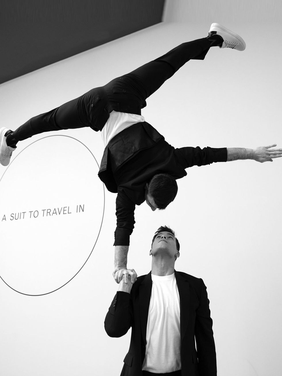 <p>How to best demonstrate the versatility of Paul Smith's new suit line? Put it on gymnasts and get them to show off their skills, of course.</p>