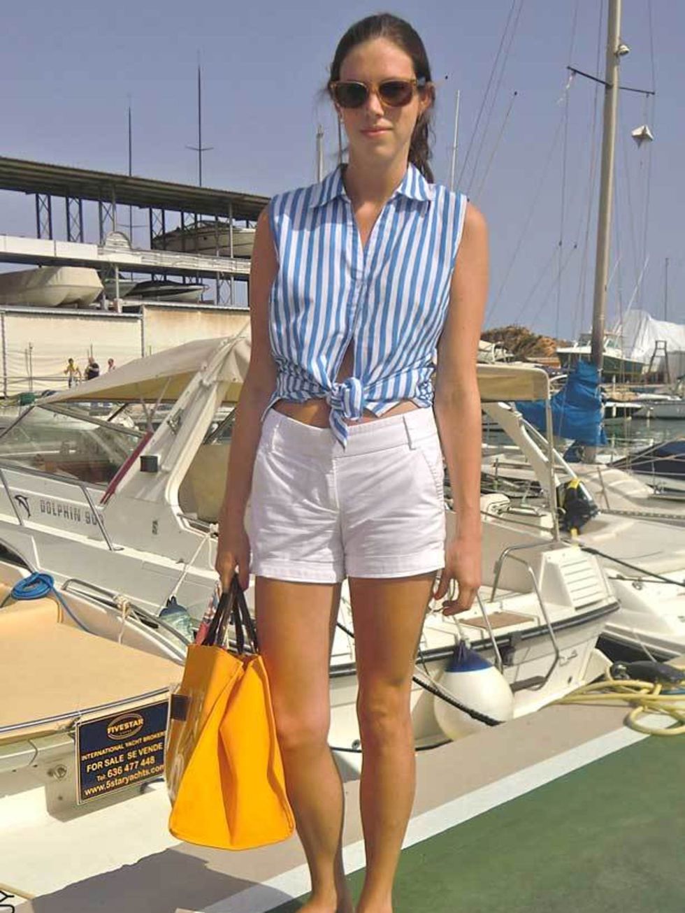 <p>Elizabeth Myers, 20, Student. Basic Editions shirts, J Crew shorts, Guinot bag, Rayban sunglasses, Havianas flip flops. </p>