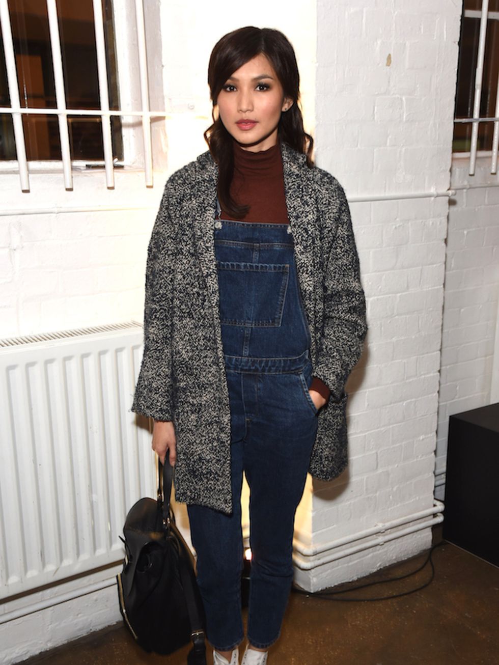 Gemma Chan does Winter dungaree wearing justice at the Whistles Men WE ARE ONE showcase.