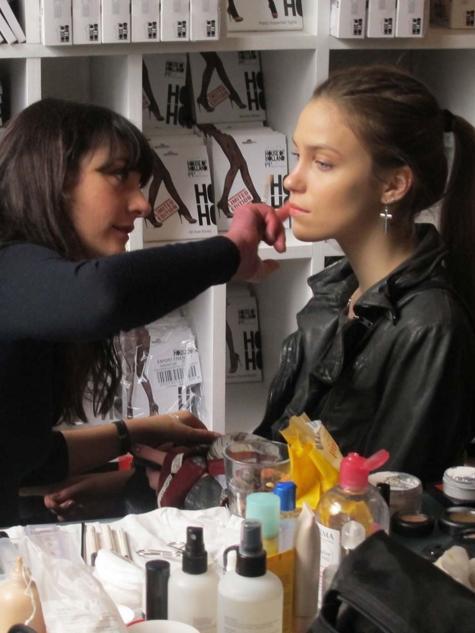 <p>A model in make-up before the House of Holland show</p>
