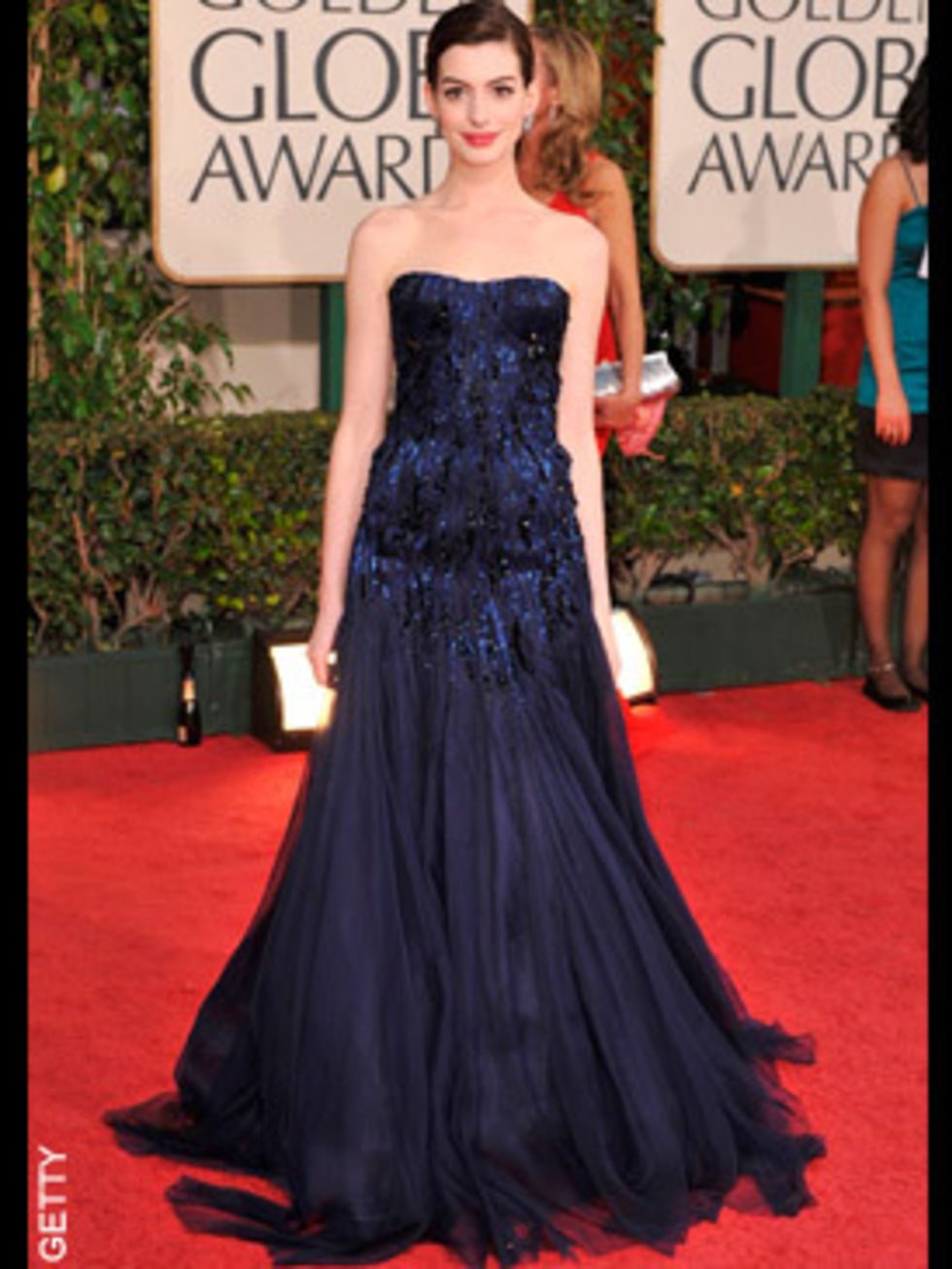 <p>Ann Hathaway opted for a gorgeous navy gown by Armani Prive</p>