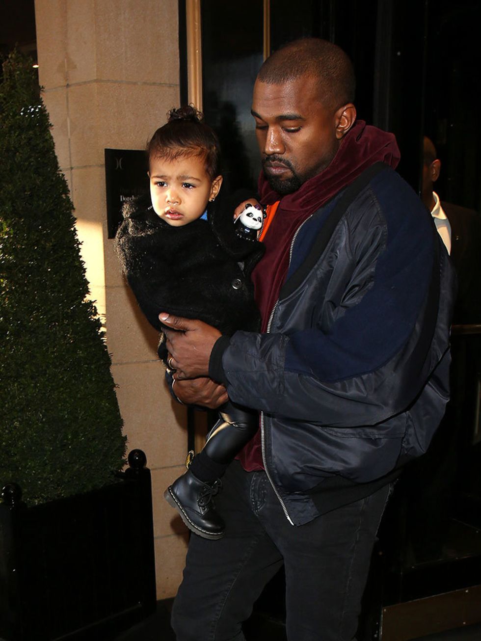 Kanye West and North West leaving the Dorchester Hotel, March 2015.