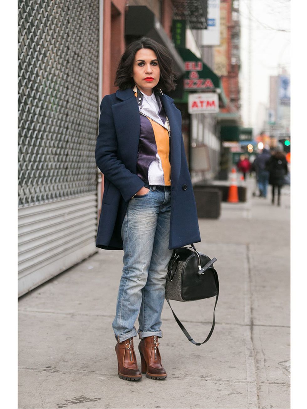 <p>Dina Ortega wears Bimba Y Lola coat, Phillip Lim leather jacket, American Eagle jeans, Prada shoes, and a YSL bag.</p>
