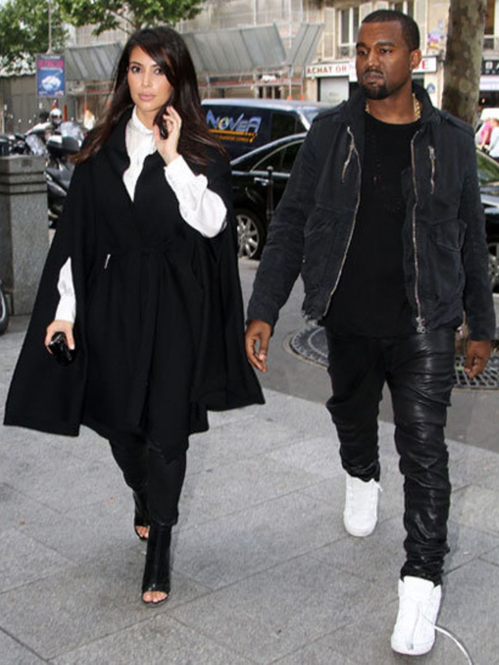 <p>Kim Kardashian and Kanye West in matching monochrome outfits</p>