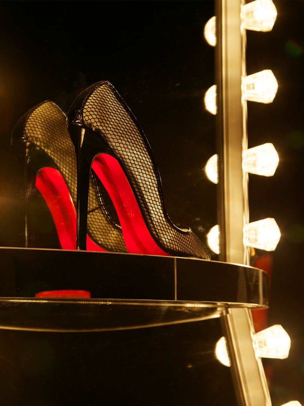 <p>Christian Louboutin shoes in a cabaret-themed at the Design Museum</p>