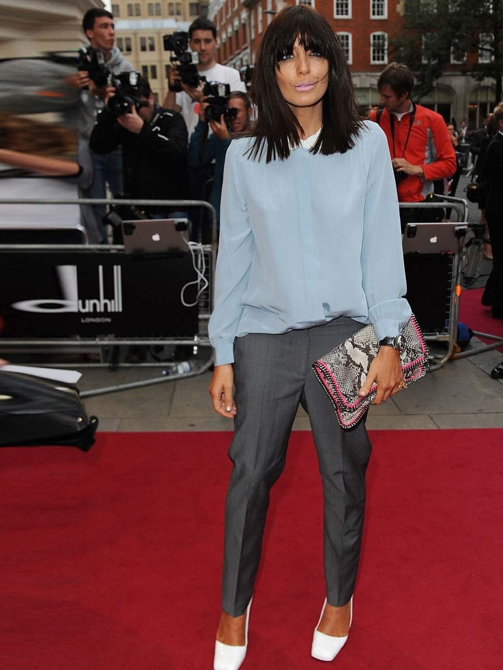 <p>Claudia Winkleman wears a Peter Pan-collared chiffon blouse, grey trousers and white <a href="http://www.elleuk.com/catwalk/designer-a-z/jil-sander/spring-summer-2013">Jil Sander</a> patent leather pumps to the fashion GQ Men of the Year Awards</p>