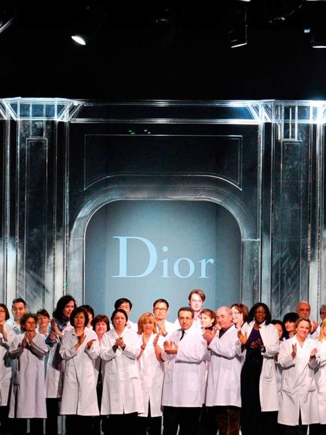 <p>Dior atelier workers take their bow at the end of the recent catwalk show</p>