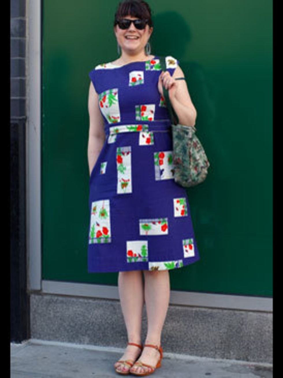 <p>We love this 50s dress, the blocks of graphic florals give it a quirky flare. Pairing a flouncy dress with Ray-Ban Wayfarers achieves a fun look that Lily Allen would be proud of.</p>