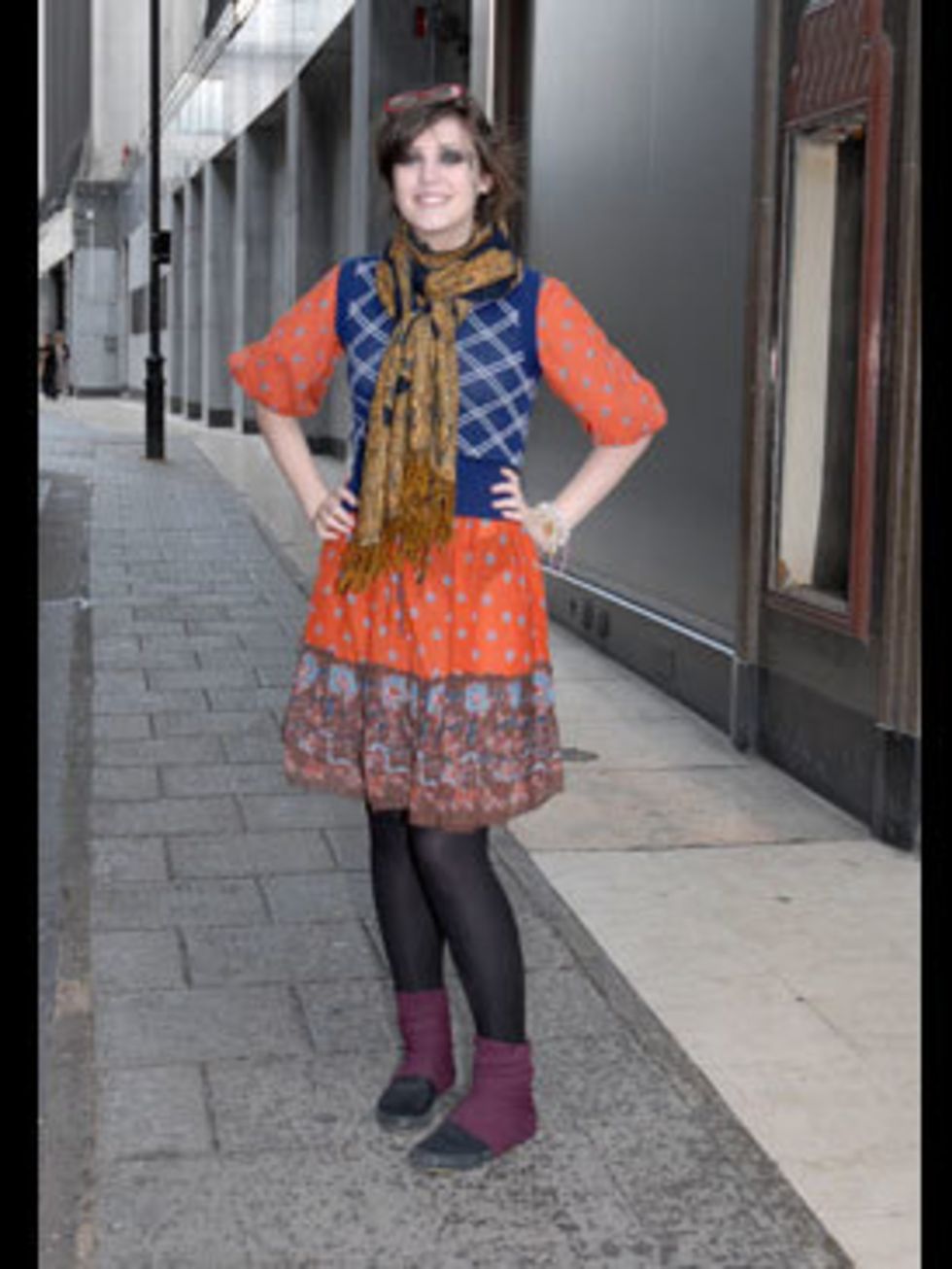 <p>Emily has gone all out, combining textures and clashing prints and carrying it off with uber confidence. She makes her own clothes and sells them online, so she knows what looks fabulous. Her plum leg warmers sit well with the purple detailing on the h