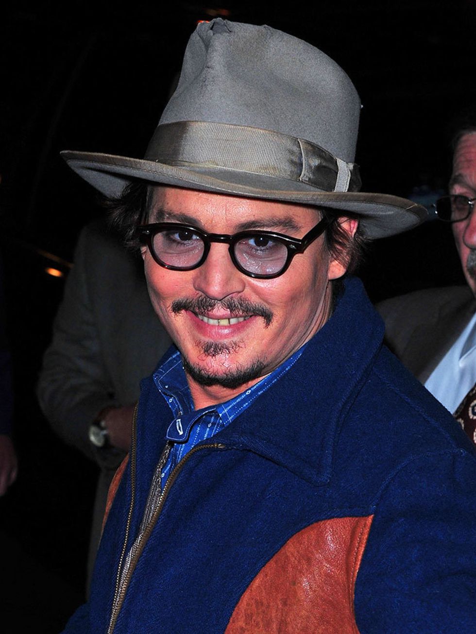 <p>Jonny Depp is fairyl sullen looking in most photos but here we caught him cheesing</p>
