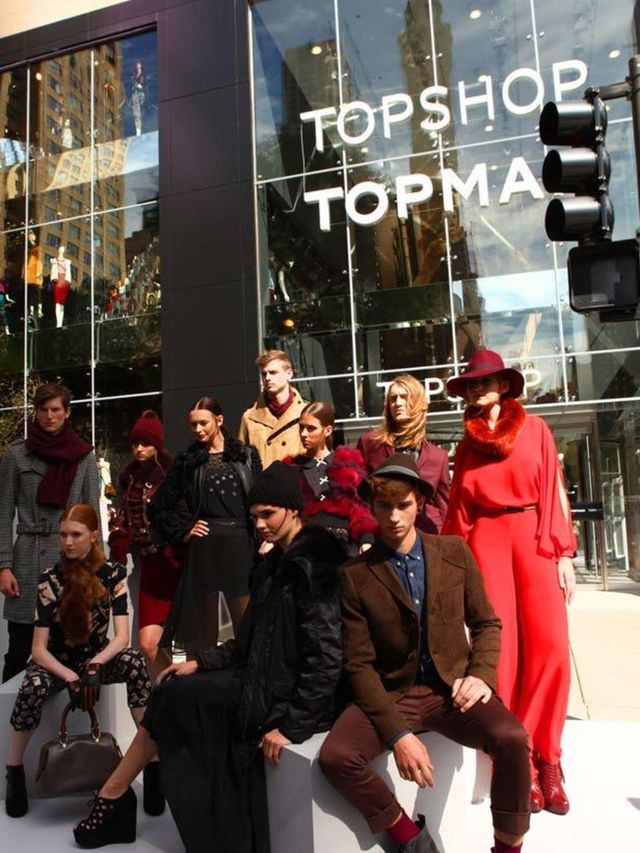 <p>Models outside Topshop's Chicago store</p>
