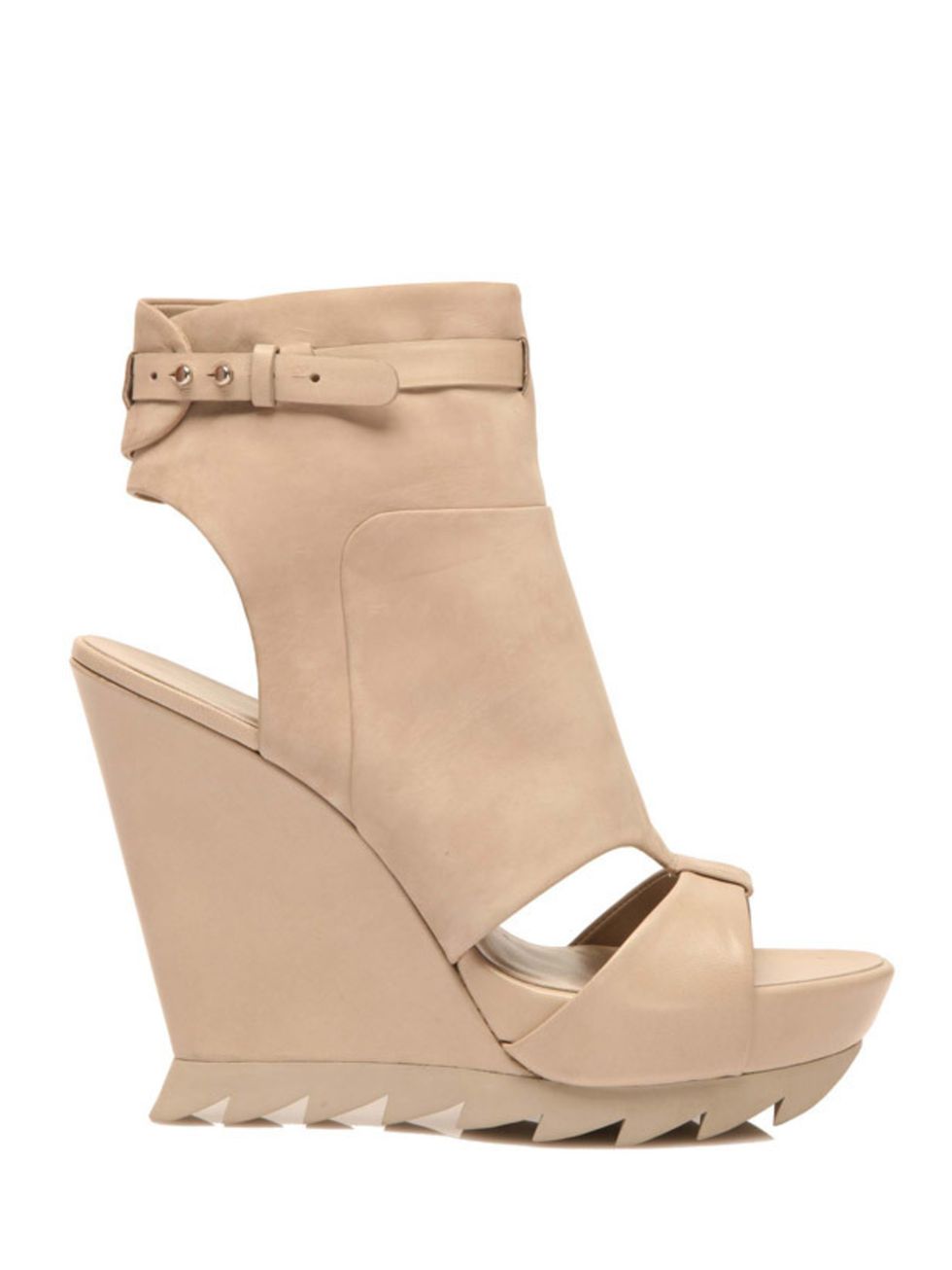 <p>Nude cut-out detail wedges, £380, by Camilla Skovgaard at Harvey Nichols (0207 235 5000) </p>