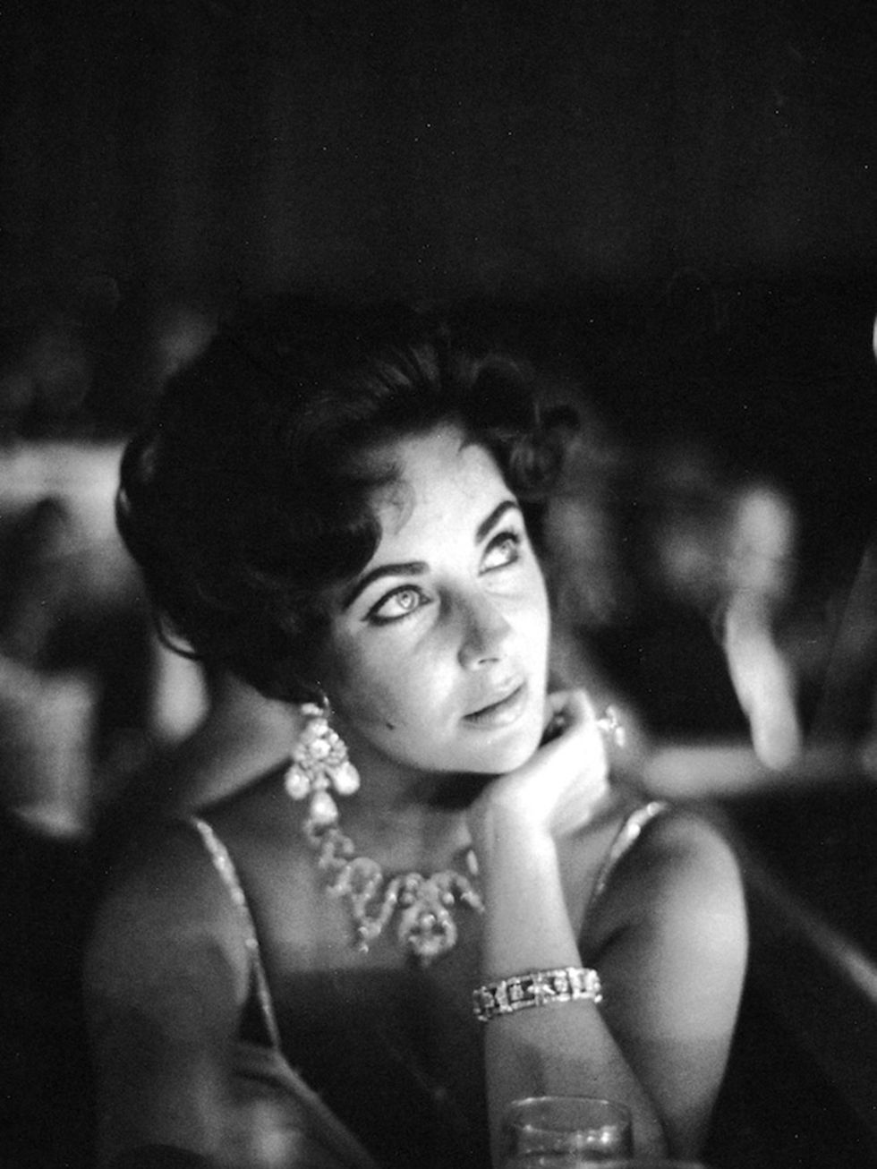 <p>Elizabeth Taylor watches her then-fiance Eddie Fisher as he performs on stage at the Tropicana in Las Vegas, 1959</p>