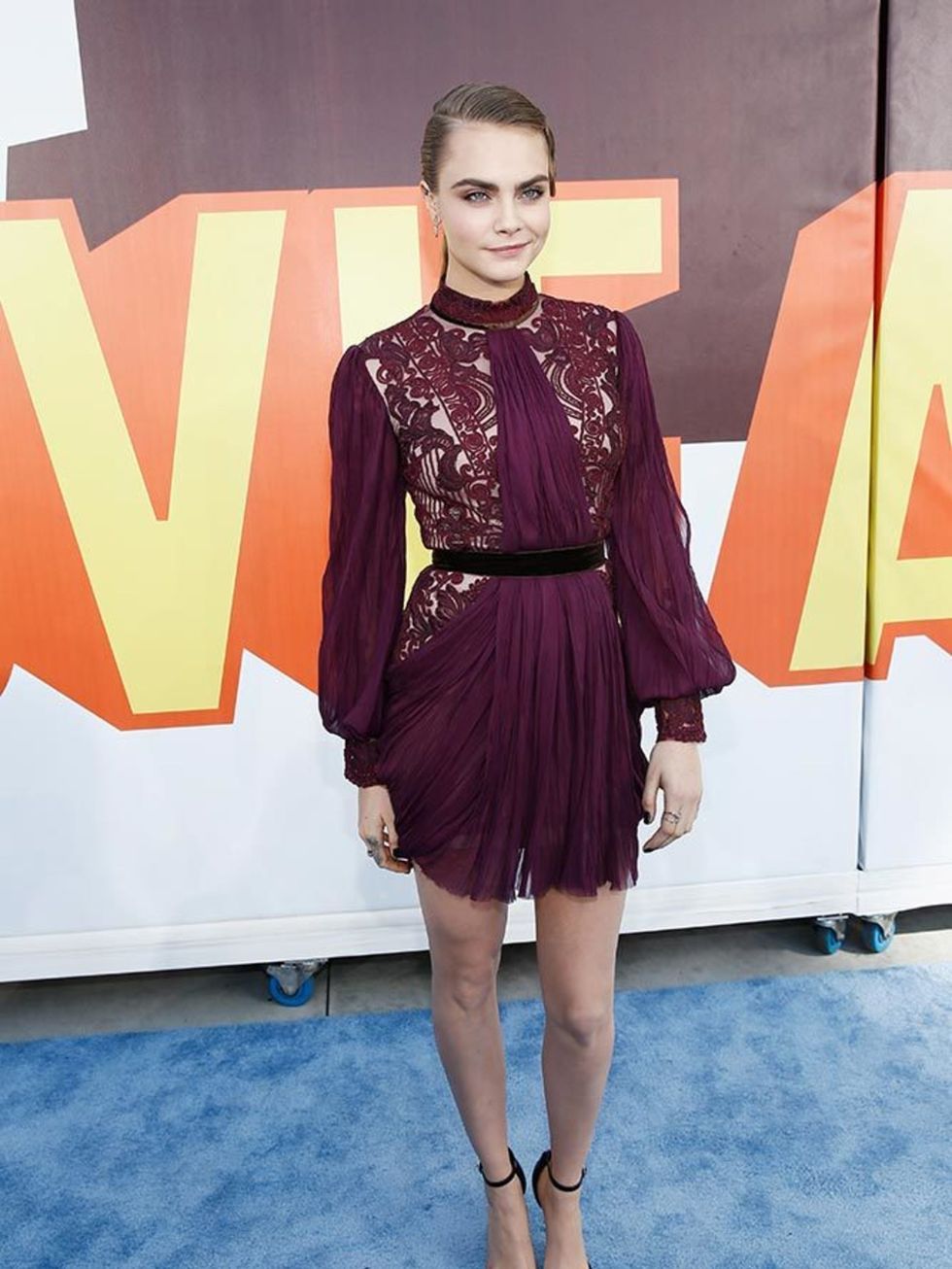 <p>Cara Delevingne attends the MTV Movie Awards in Los Angeles, wearing in a Reem Acra dress and Saint Laurent shoes.</p>