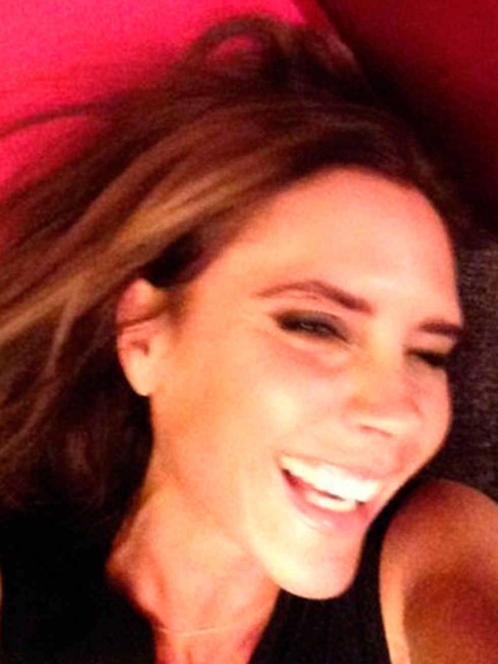 <p>Yes, she does smile. Not only that, but she makes fun of herself when she does it. And publicly.</p><p><em>Victoria Beckham smiles in a 2013 selfie.</em></p><p><a href="http://www.elleuk.com/star-style/celebrity-style-files/victoria-beckham-style"></a>