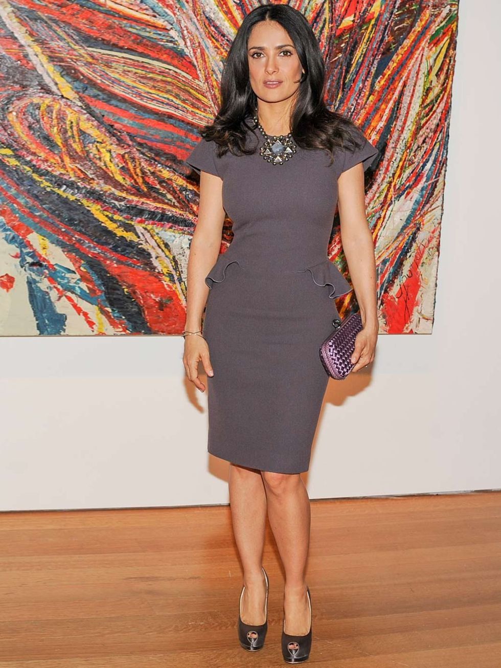 <p>Salma Hayek attends the Christie's post-war and contemporary art sale wearing a grey peplum dress.</p>